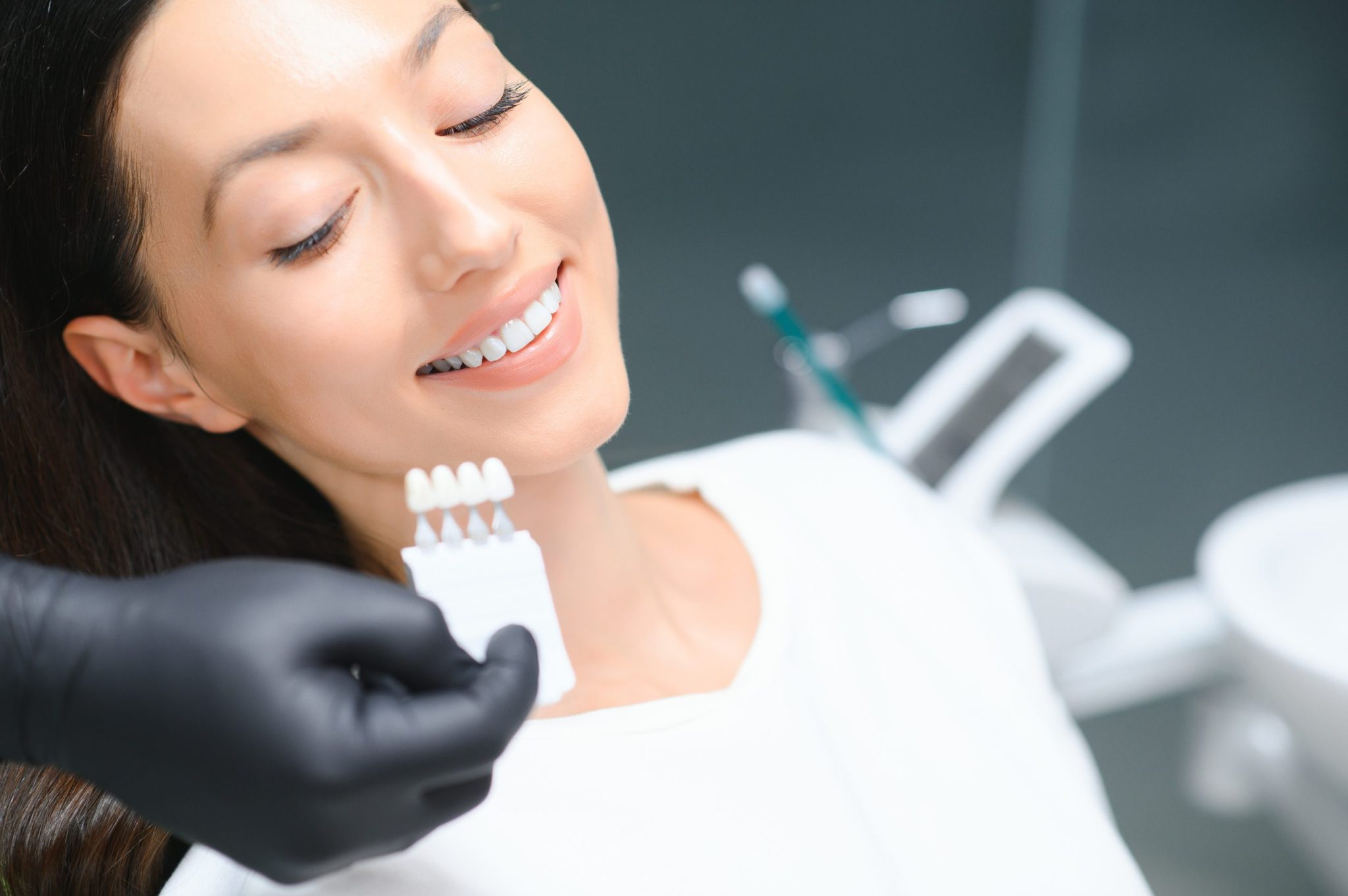 dentist-checking-and-selecting-color-of-young-woma-2025-03-15-06-50-03-utc-scaled-1-2048x1362